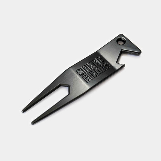 A black divot tool or pitch mark repairer