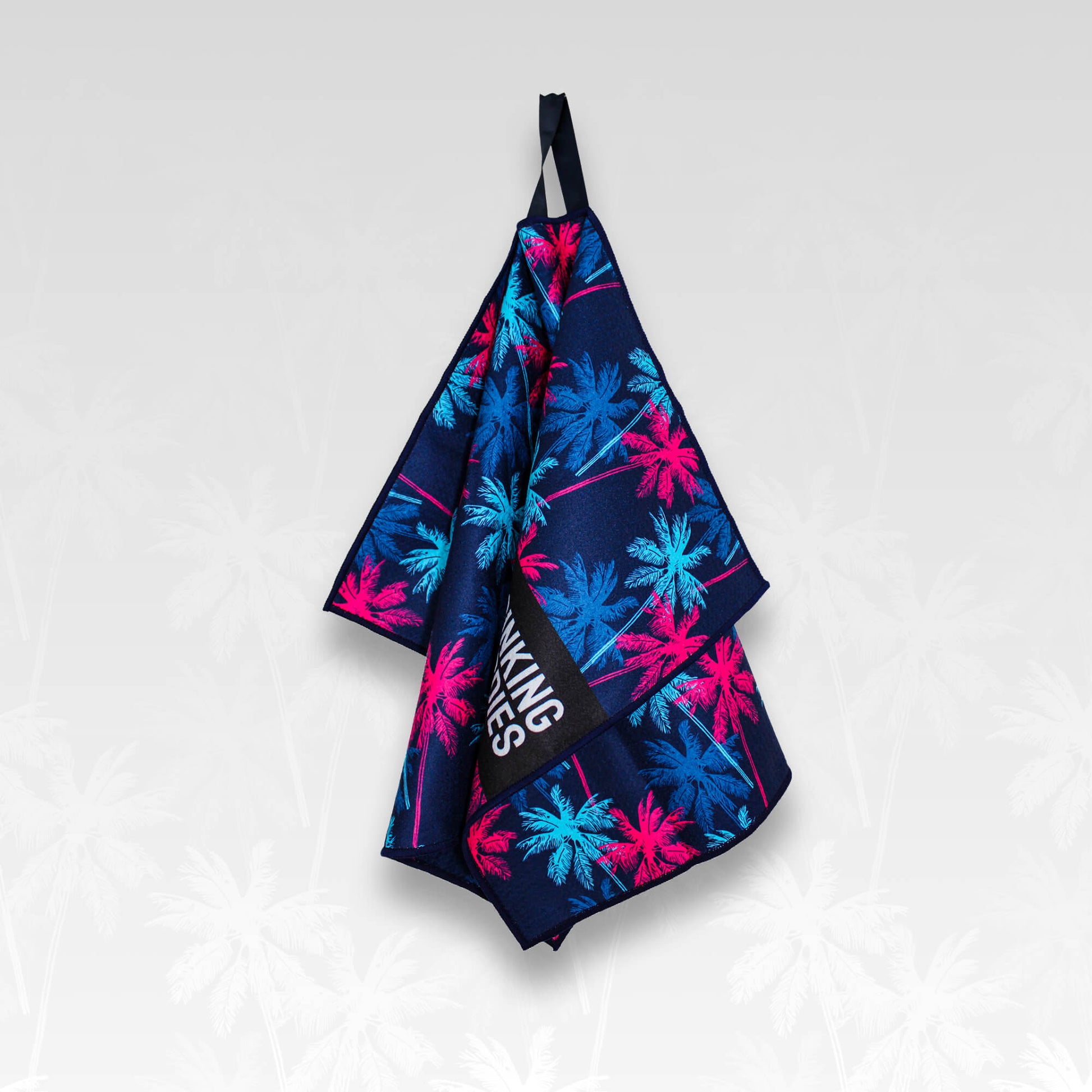 A hanging Palm tree patterned microfibre golf towel