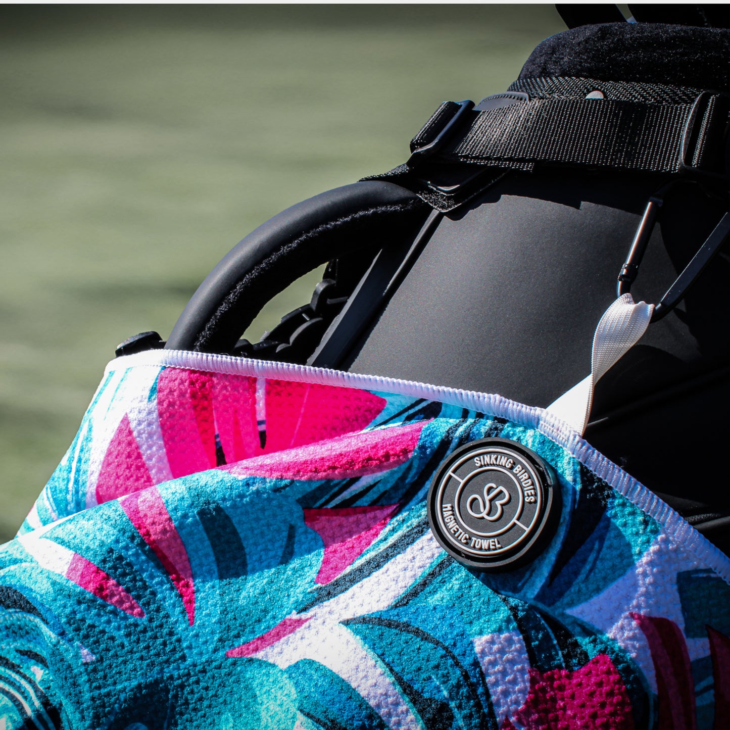 A magnetic golf towel on the golf course
