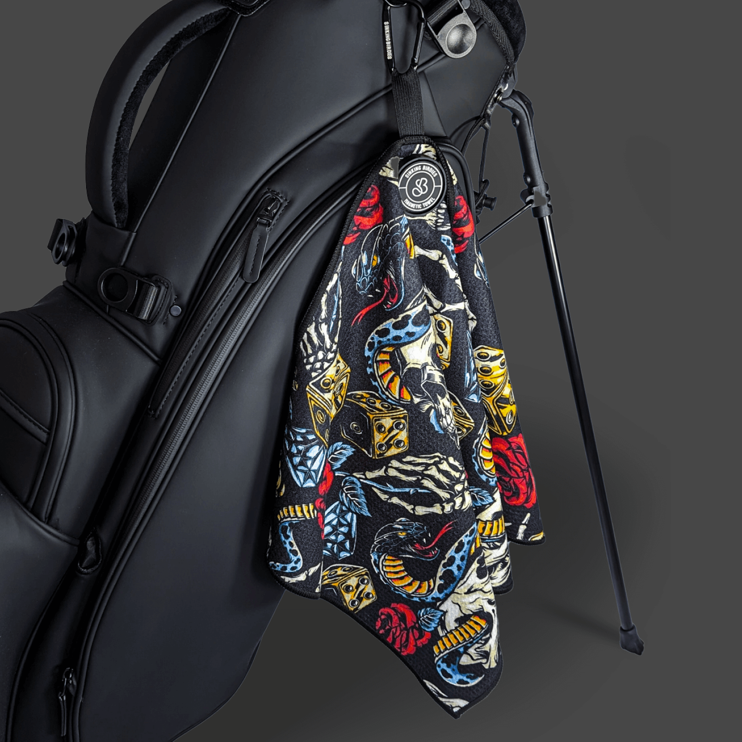 A magnetic microfibre golf towel on a golf bag