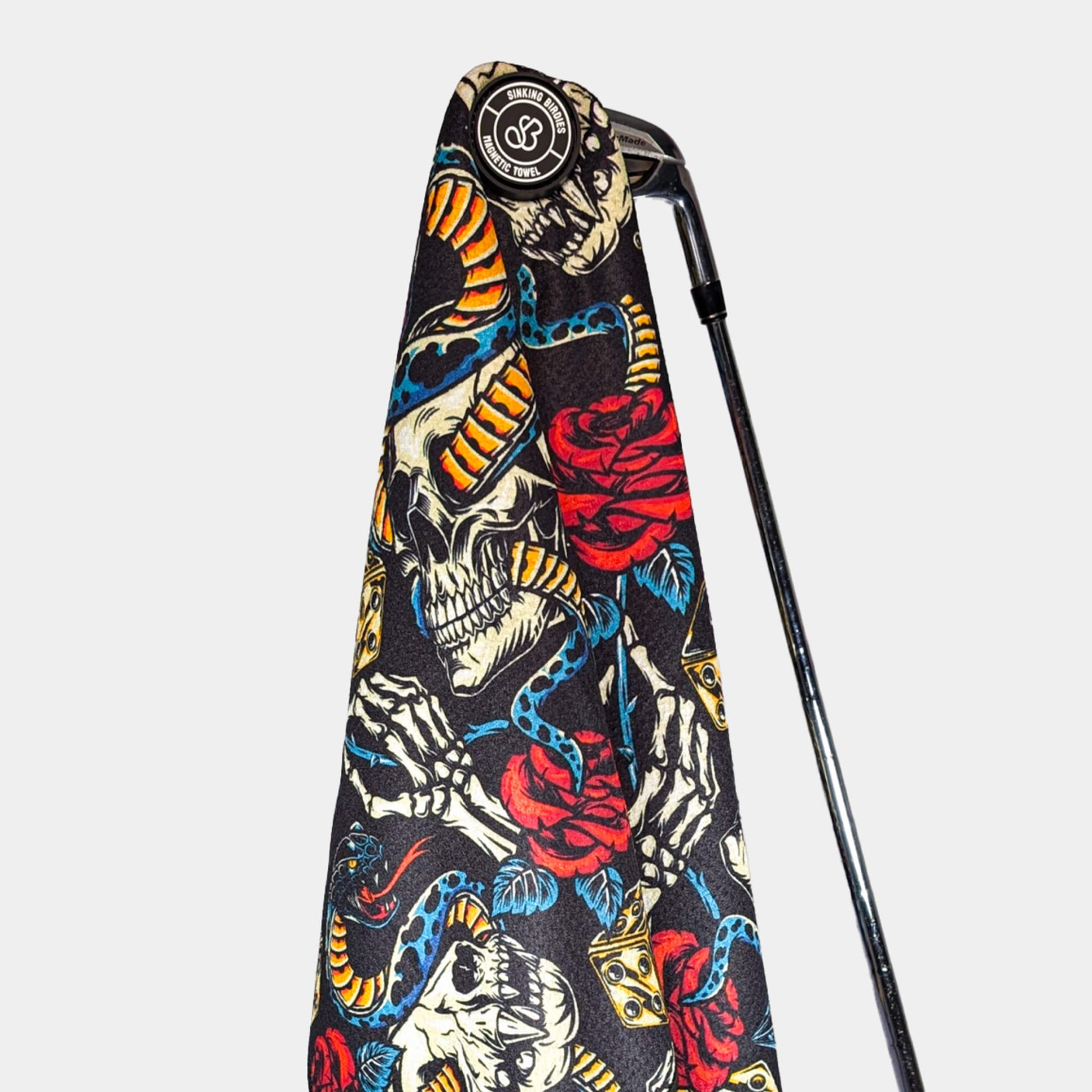 Magnetic golf towel hanging from golf club