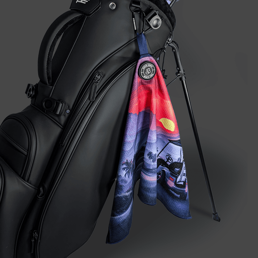 A magnetic microfibre golf towel on a golf bag