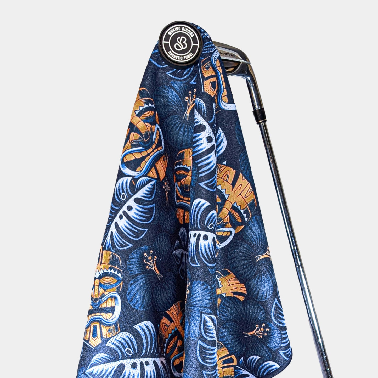 Magnetic golf towel hanging from golf club