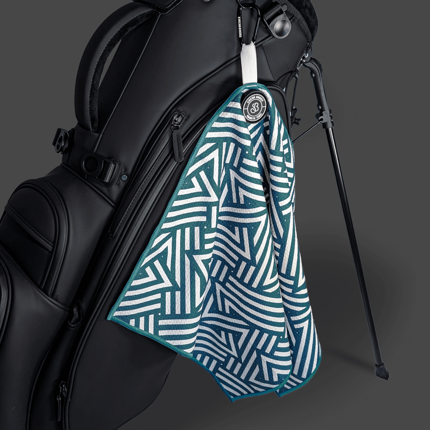 A magnetic microfibre golf towel on a golf bag