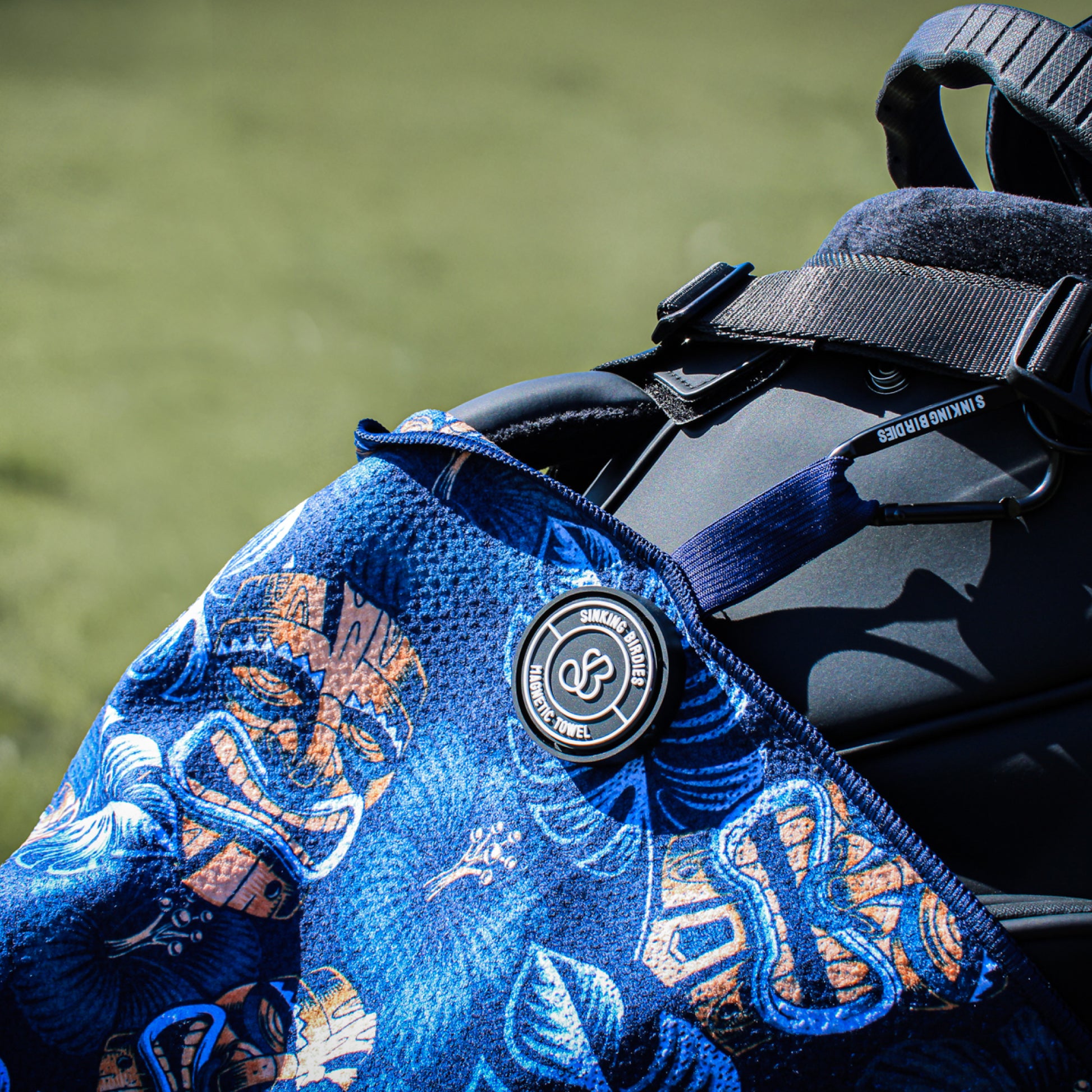 A magnetic golf towel on the golf course
