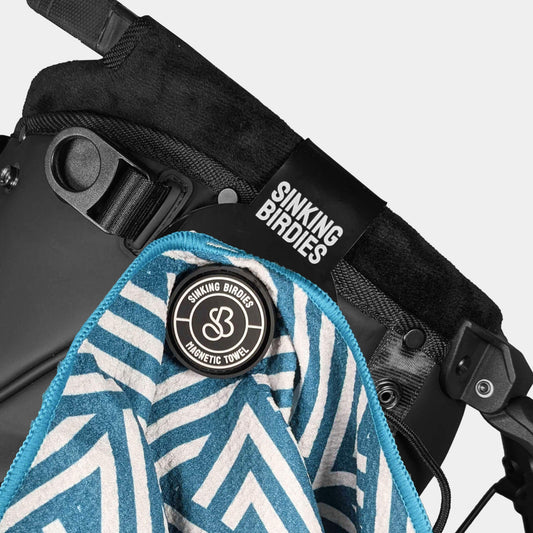 close up of a blue zigzag pattern towel on a golf bag