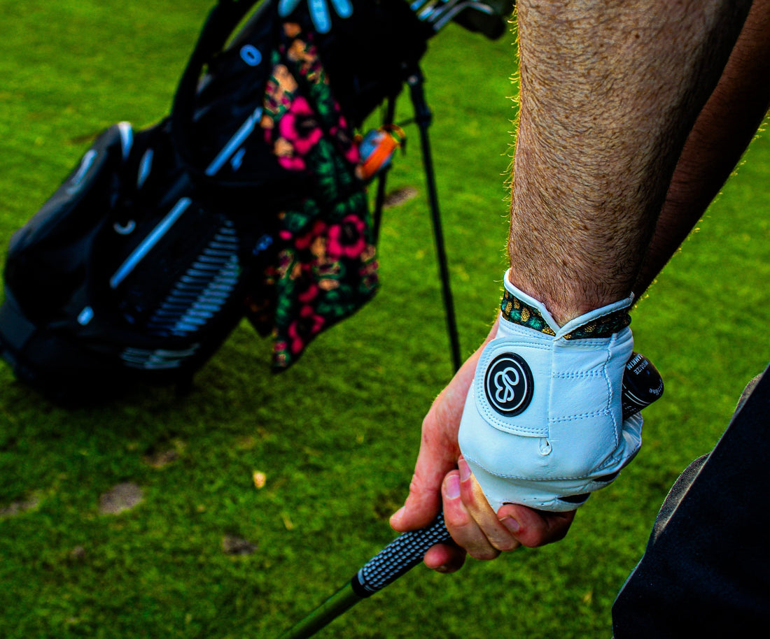 Close-up of a golfer wearing a Cabretta leather golf glove at the start of aswing