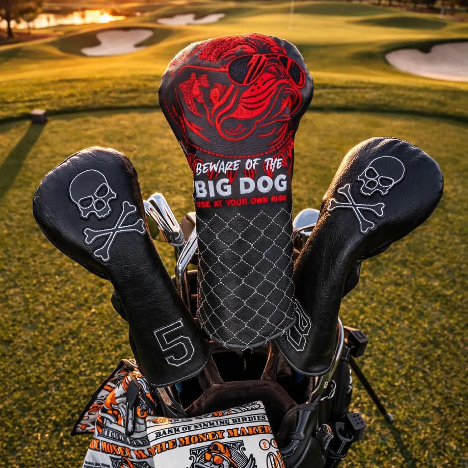 Golf club headcovers with sbig dog design on a golf course background