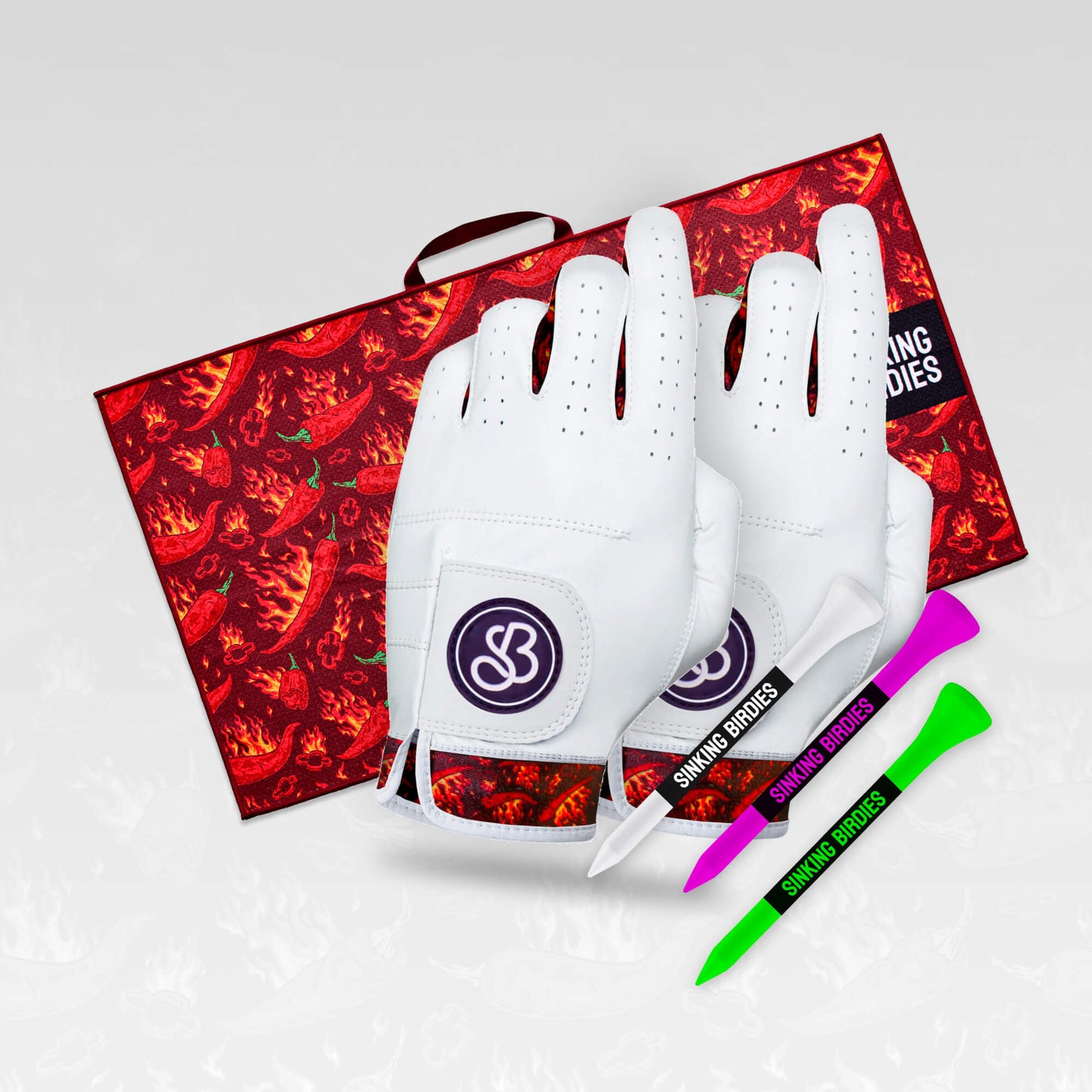 A group of flaming chilli pepper patterned golf accessories and gifts