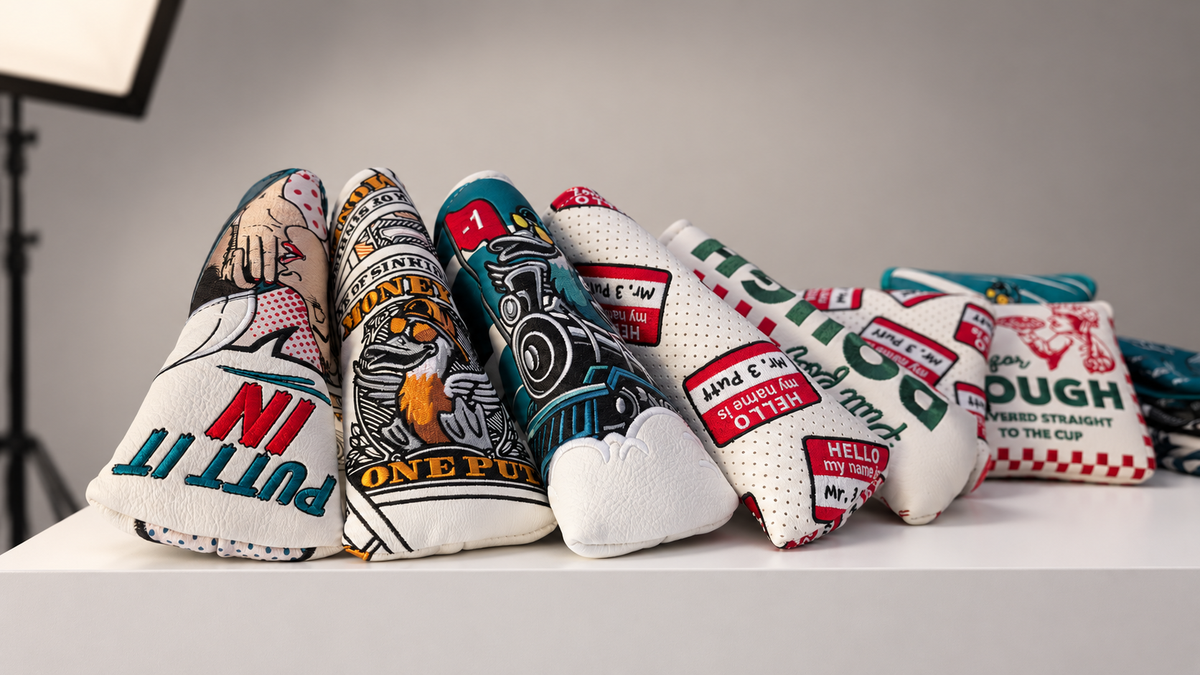 Sinking Birdies headcovers displayed on a white photography-studio plinth